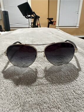 Authentic CHANEL gold frame sunglasses with black temples